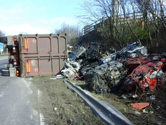 The Junction 25 eastbound slip on the M62 is closed after a HGV carrying crushed cars overturned. Photo credit: Highways England