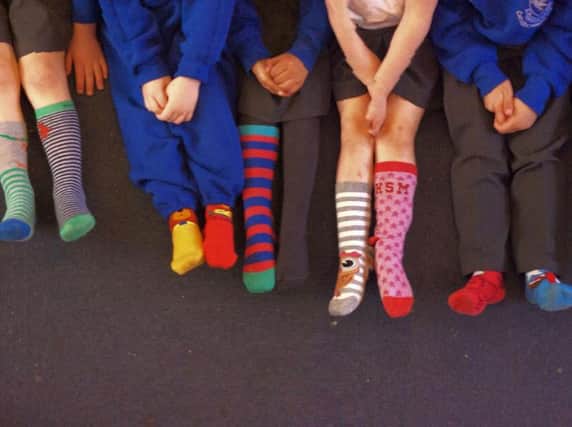 Wearing odd socks to mark World Down Syndrome Day