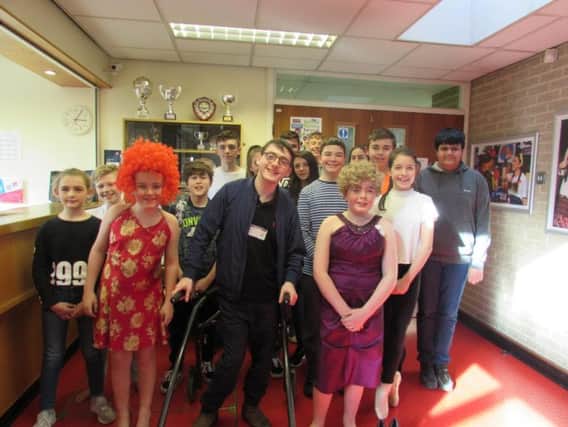 Jack Carroll with pupils at Brighouse High School