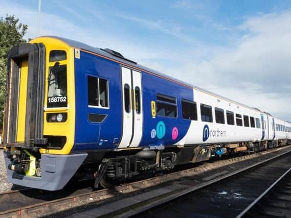 A man assaulted a woman on a train from Manchester Victoria to Halifax.