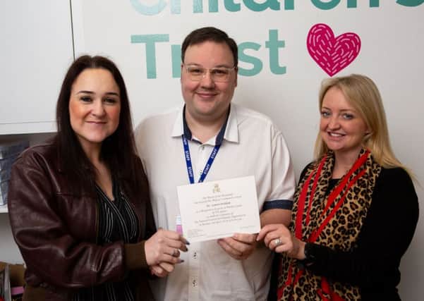 Sarah Thompson, Simon Widdop and Rachael Hawkins, from Yorkshire Children's Trust, celebrating Simon's invite to see the Queen