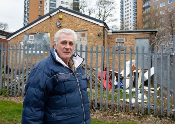 Tony Woodhead, unhappy with rubbish dumped in yard of Mixenden shops