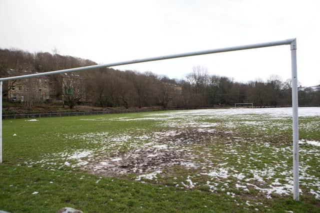 Snow and mud covered football pitch at Luddendenfoot