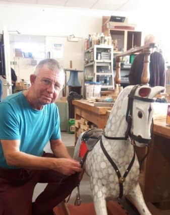 Chris Freeman, a member of The Phoenix Shed at the Threeways Centre in Ovenden, with a rocking he has made there