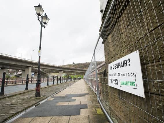New barriers and Samaritans signs up un North Bridge, Halifax.