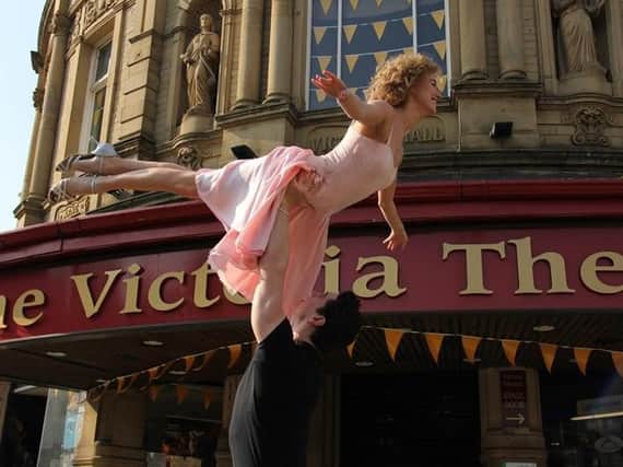 The stars of Dirty Dancing perform the iconic lift outside the Victoria Theatre in Halifax.