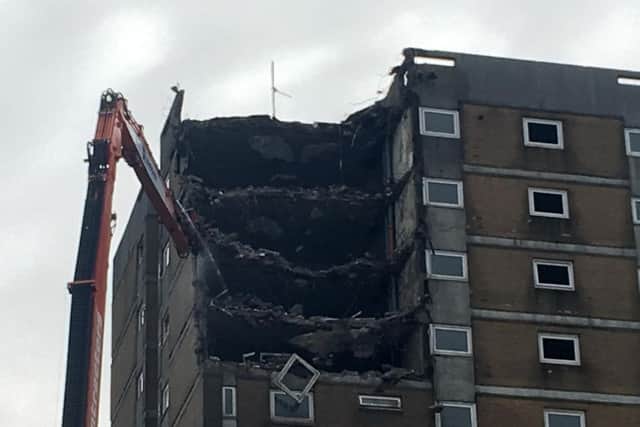 Work has begun to demolish tower blocks at Beech Hill estate in Halifax.