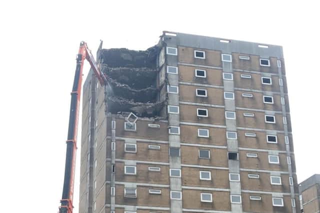 Work has begun to demolish tower blocks at Beech Hill estate in Halifax.