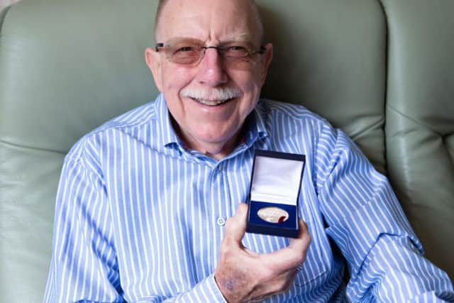 John McBride, from Lightcliffe, with his medal