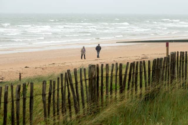 People walk on Sword Beach in Colleville-Montgomery, on June 5, 2018 near Caen, France. Getty Images.