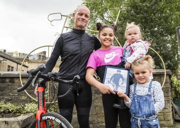 Mick Denton, who is doing a bike ride from John Oâ¬"Groats to Lands End for Martinhouse Hospice, in memory of Lee Hunter, with Lee's daughters Lola Hunter, 11, Indie Hunter, one, and Poppy Hunter, four.