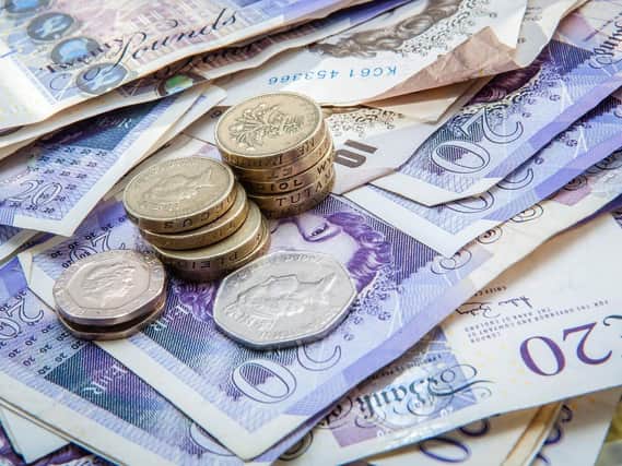 Calderdale and Kirklees households have 600 less spending money than the average for Yorkshire and the Humber, figures show.