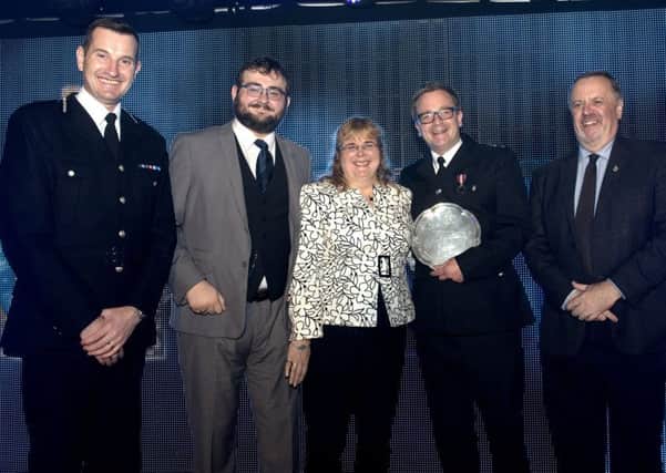 Ben Doughty (fourth from left) receiving his Colin Cramphorn Trophy for Contribution to Neighbourhood Policing at the West Yorkshire Policing Awards