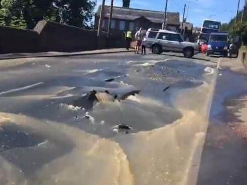 Last June the roadwas cracked open by gallons of waterjust between the junction at Ploughcroft Lane and Claremount Road.