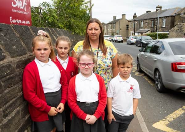 Head Teacher Jill Elam with children at Shelf J&I School, concerned about traffic speeding and parking around the school