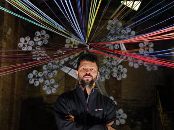Conrad Shawcross installs his 'Chord' spinning machine into the Jute shed at Dean Clough Mills.