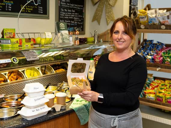 Katrina Phipps with the new plastic-free containers at Toppers Deli.
