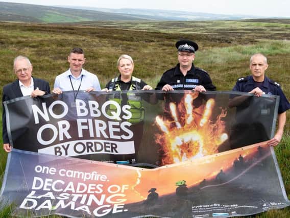 Coun Tim Swift, Ollie Crosland, SCSW Natasha Lymm, valleys inspector Ben Doughty and Tomorden Fire watch commander Geoff Shaw. WYFRS launching moorland fire campaign, Byrons Edge, Turvin Road