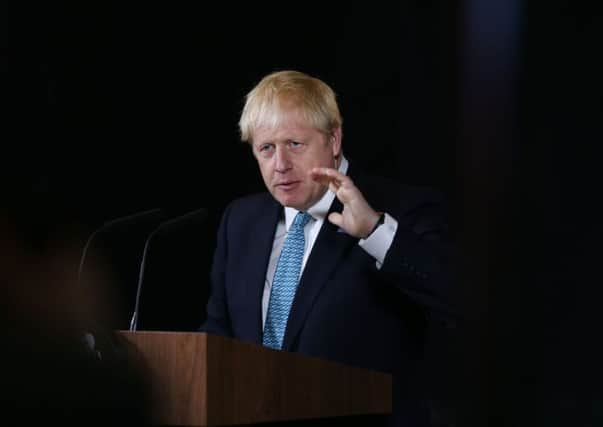 MANCHESTER, ENGLAND - JULY 27: Britain's Prime Minister Boris Johnson gestures during a speech on domestic priorities at the Science and Industry Museumon July 27, 2019 in Manchester, England. The PM announced that the government will back a new rail route between Manchester and Leeds. (Photo by Lorne Campbell - WPA Pool/Getty Images)
