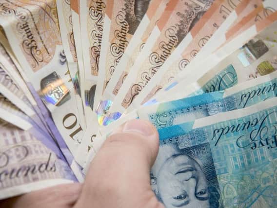 A Brighouse woman has been sentenced at Bradford Crown Court for taking money from a vulnerable Calderdale resident