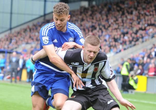13 May 2017.......    Halifax Town v Choley National Conference North Play-off Final at the MSI stadium Halifax. 
Towns Dion Charles grapples with Chorley's Matt Challaner. Picture Tony Johnson.