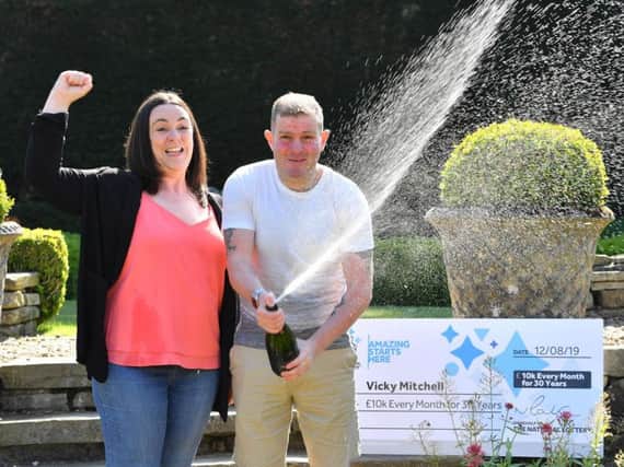 Vicky Mitchell, from Halifax, celebrates her National Lottery win with her partner Adam at the Holdsworth Hotel in Halifax. Picture by Anthony Devlin.