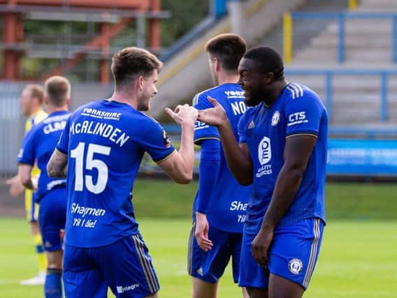 Liam McAlinden and Jerome Binnom-Williams. FC Halifax Town 2-1 Solihull Moors at The Shay. Photo: Bruce Fitzgerald