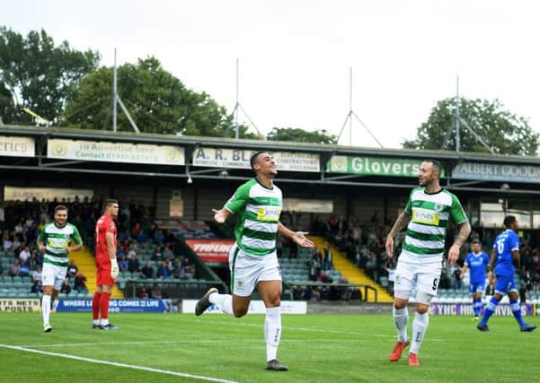 YEOVIL, ENGLAND - AUGUST 06: Courtney Duffus of Yeovil Town(C) celebrates after scoring his sides first goal during the Vanarama National League match between Yeovil Town and Eastleigh FC at Huish Park on August 06, 2019 in Yeovil, England. (Photo by Harry Trump/Getty Images)