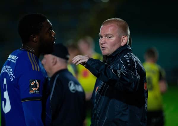 Action from FC Halifax Town v Harrogate, at the Shay, Halifax. Pictured is Jerome Binnom-Williams and manager Pete Wild