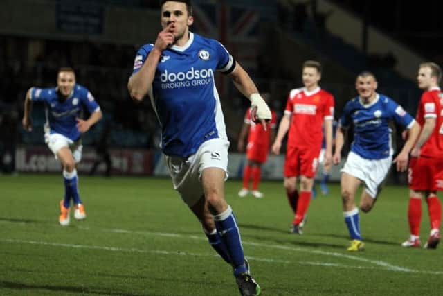 Lee Gregory celebrates scoring the first of his two goals, as Halifax Town won 2-0 over Alfreton at The Shay