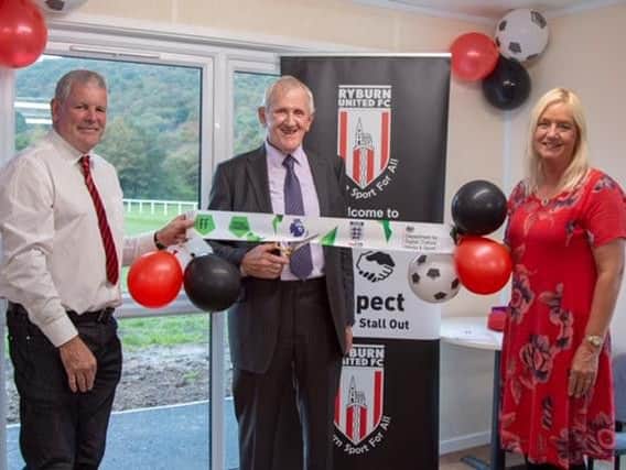 Ryburn United Juniors FC Chairman, Ian Forbes, Life Member, Richard Armitage and Chairman's wife, Judith Forbes cut the ribbon to the new pavilion.