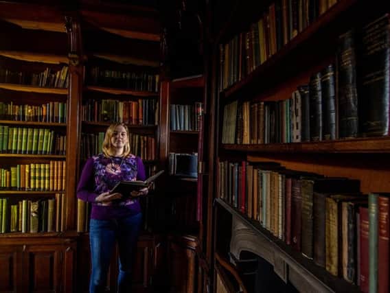 Angela Clare, Collections Manager for Calderdale Museums, in the Tower Library at Shibden Hall, Halifax