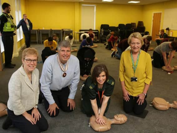 School governors Lynnette Cassidy, Neil Davidson and Francis Millington, with Helen Byrnes from Yorkshire Ambulance Service, for the Re-start a Heart event, at  Crossley Heath School, Halifax