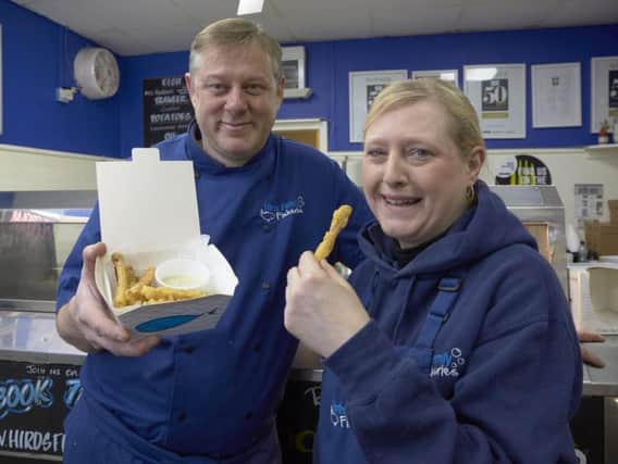 Adam and Alison Hird with their award winning chorizo fries with pesto sauce at their fish and chip shop in Siddal.