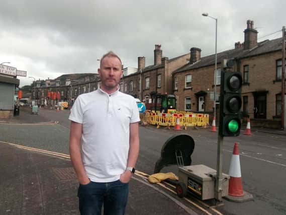 Darren Leach, owner of Cuttin Edges Carpets by the Ovenden roadworks.