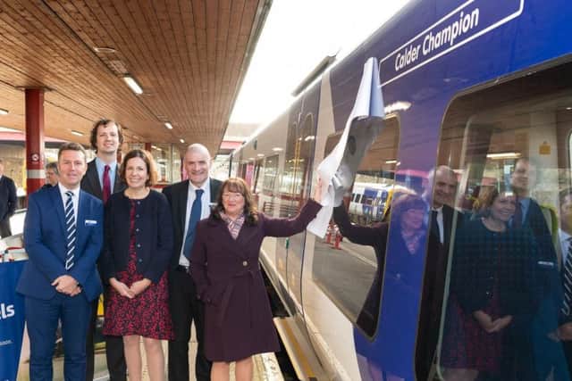 NORTHERN: Cllr Kim Groves unveils the new train name, helped by (l-r) David Brown - Northern's Managing Director, Cllr Alex Ross-Shaw of WYCA , Hilary Tysoe - HR Director at Arriva and Steve Hopkinson - Regional Director at Northern.