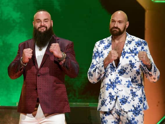 WWE wrestler Braun Strowman (L) and heavyweight boxer Tyson Fury pose during the announcement of their match at a WWE news conference. (Photo by Ethan Miller/Getty Images)