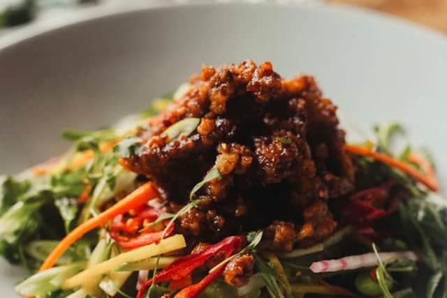 Hot Asian Beef on a Salad of Little Gem, Rocket, Soya Beans, Peas, Mange Tout, Chilli, Spring Onion & Fresh Vegetables with a Sweet & Sour Dressing