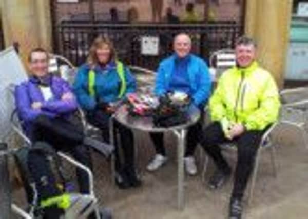 Steve Duncan, of the Community Foundation for Calderdale, third left, and fellow cyclists at a cafe in Cornwall on the first day of their 900 mile long Lands End to John O'Groats bike ride.