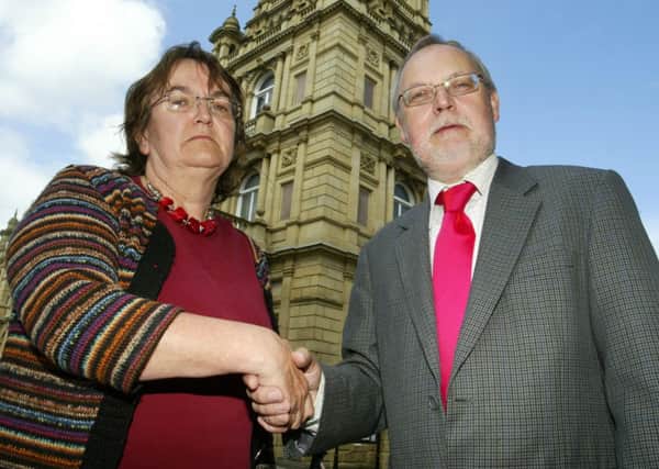 Janet Battye and Tim Swift shake hands outside Halifax town hall