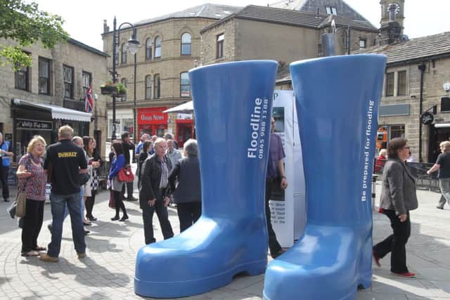 Environment Agency and Calderdale Council in St George's Square, Hebden Bridge, to mark anniversary of 2013 floods.