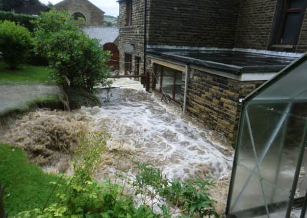 Reader Norman Caddy took this photographs of flood water around the  Fir Wood Close and Melbourne Terrace area of Walsden on July 29