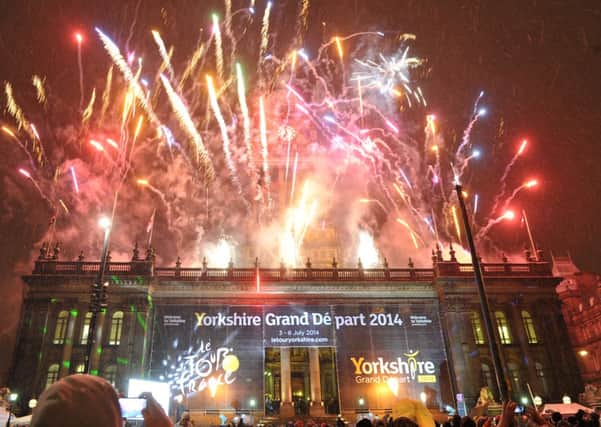 Fireworks light up the sky above Leeds Town Hall in celebration of the Yorkshire Grand Depart Le Tour de France 2014.
