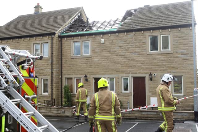 Fire fighters at the scene of a house fire, Pear Tree Close, Lightcliffe.