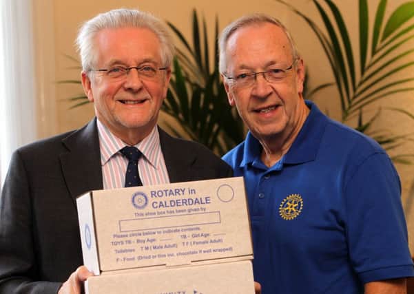 Wilson Simms, chair of Community Vocational Committee and Bryan Harkness, Shoebox team leader, launch the Rotary Club and Halifax Courier Shoebox Appeal