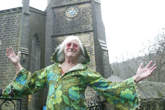Sir Jimmy Savile during a visit to St John's church, Cragg Vale