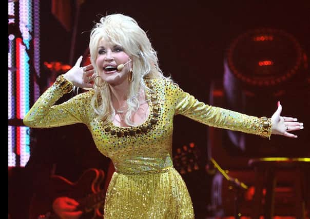 US singer Dolly Parton performs in concert at the O2 Arena in London on Wednesday, Sept. 7, 2011.  (AP Photo/Mark Allan)