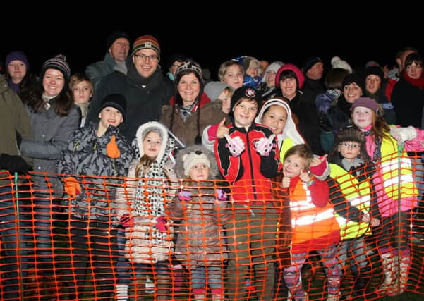 Front row for the heat of the fire at last year's Elland Rotary Club Charity bonfire and fireworks display, Elland Recreation Ground
