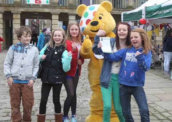 Pudsey Bear at the Piece Hall, Halifax pictured with Nathan Naylor, Ruby Trith, Olivia Raby, Sydney Love and Brittany Butterworth