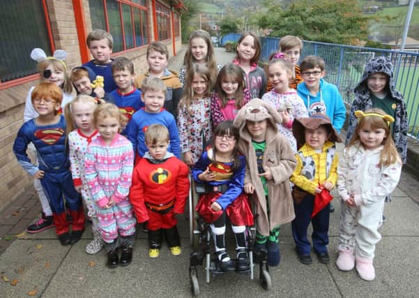 Children at Luddenden CE School dressed in pyjamas and as superheroes for Children in Need.